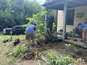 Volunteers and workers helping Cottage at Cool Spring Nature Preserve